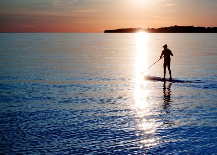 A Sunset Over A Body Of Water